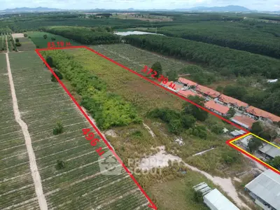 Expansive land plot with lush greenery and clear boundary lines, ideal for development or agriculture.