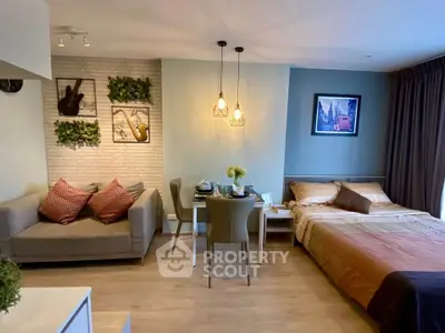 Modern studio apartment with cozy living area and stylish decor