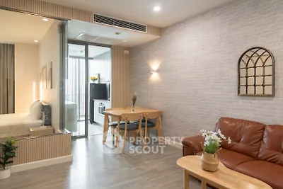 Modern living room with open layout, stylish decor, and cozy seating area in a contemporary apartment.