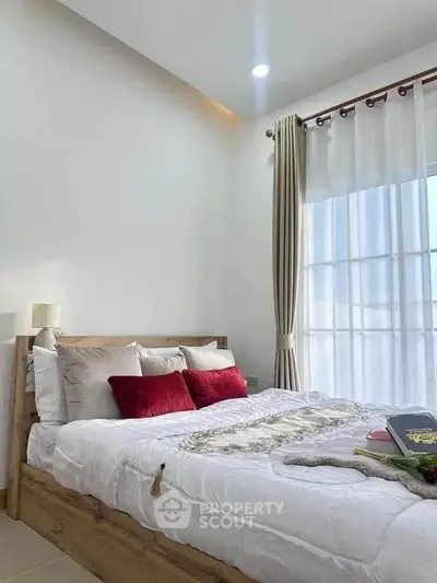 Cozy bedroom with natural light and stylish decor