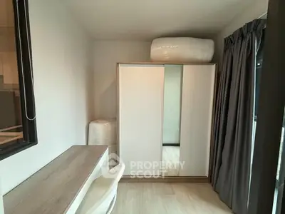 Modern study room with sleek desk and wardrobe, perfect for productivity.