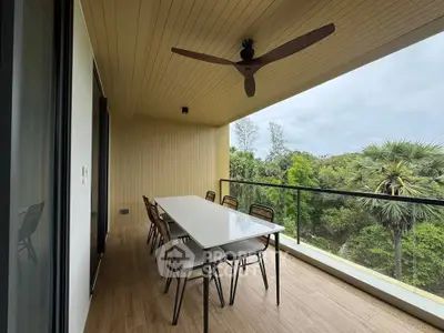Spacious balcony with dining set and scenic view, perfect for outdoor gatherings.