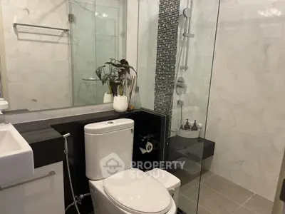Modern bathroom with glass shower and stylish decor