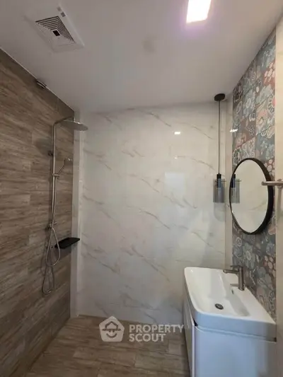 Modern bathroom with stylish shower and elegant sink design