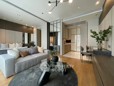 Luxurious modern living room with open kitchen, stylish decor, and elegant furniture in a contemporary apartment.