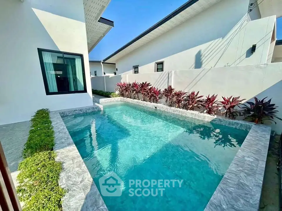 Stunning modern home with private pool and lush garden, perfect for relaxation and entertaining.