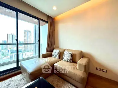 Modern living room with city view, featuring a cozy leather sofa and large windows for natural light.