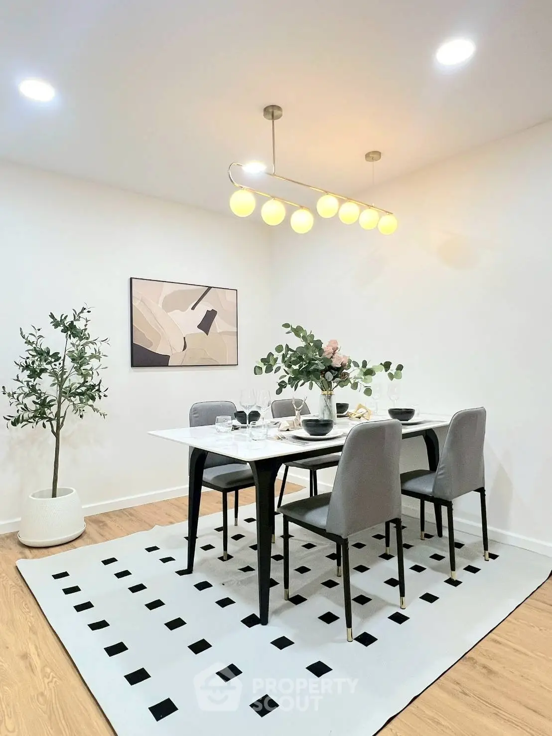 Modern dining area with elegant lighting and stylish decor