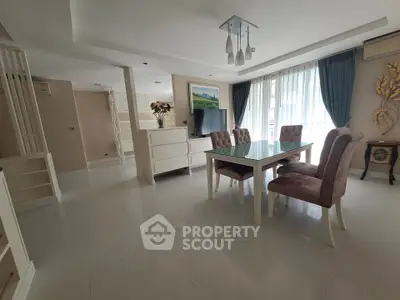 Spacious dining area with elegant decor and natural light in modern apartment