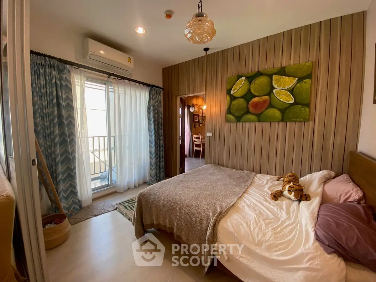 Cozy bedroom with balcony access and stylish decor