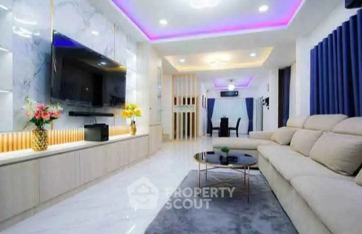 Luxurious modern living room with LED lighting and elegant decor