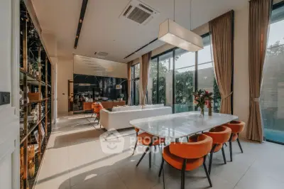 Luxurious modern living room with elegant dining area and floor-to-ceiling windows.