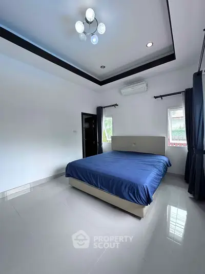 Spacious bedroom with modern design and natural light