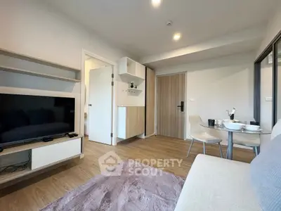 Modern living room with stylish furniture and open layout, perfect for cozy gatherings.