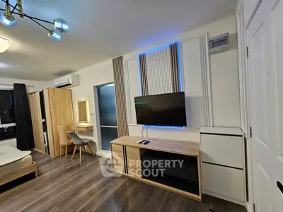 Modern studio apartment with stylish decor and ambient lighting