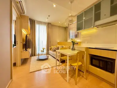 Modern open-layout living room and kitchen with stylish furniture and warm lighting