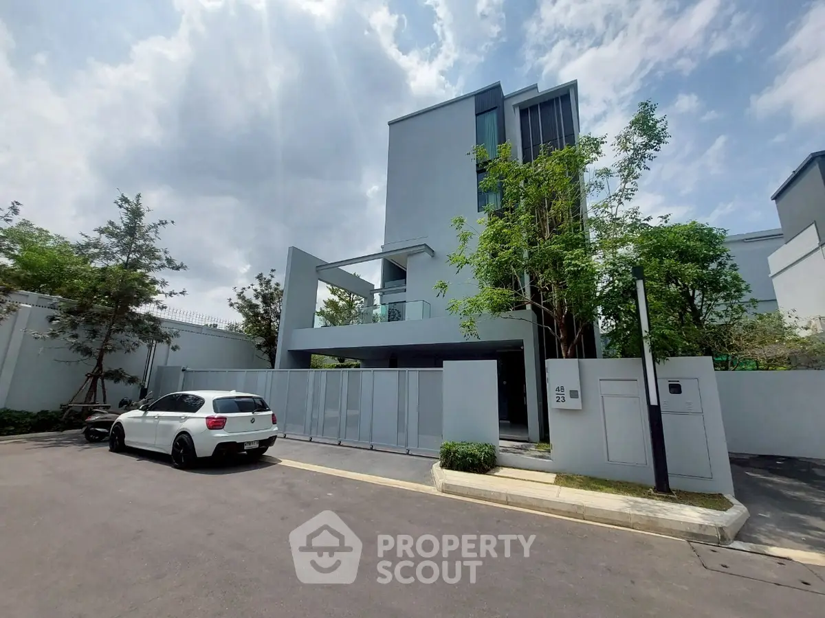 Modern minimalist house with sleek design and spacious driveway