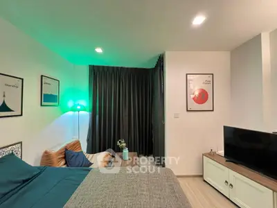 Cozy bedroom with modern decor and ambient lighting, featuring a comfortable bed and stylish wall art.