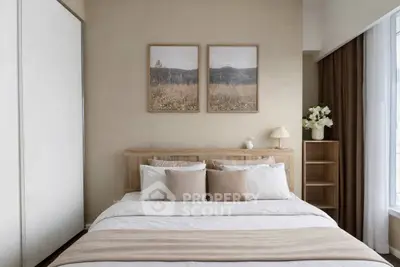 Elegant bedroom with neutral tones, cozy bedding, and stylish decor for a serene atmosphere.