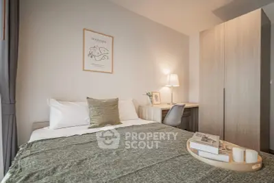 Cozy bedroom with modern decor and study area, perfect for relaxation and productivity.