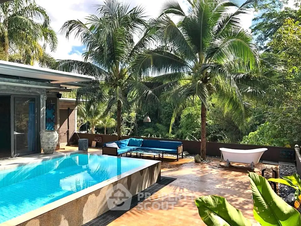 Luxurious tropical villa with private pool and lush garden view