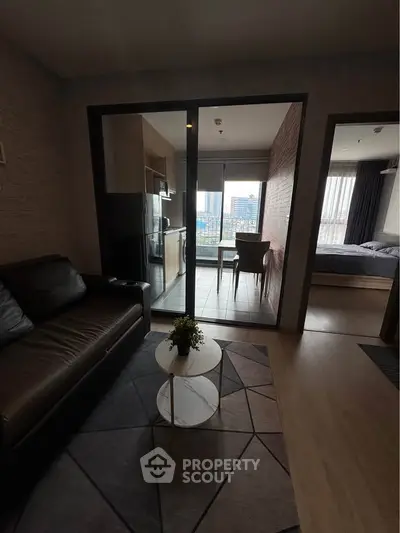 Modern apartment interior with living room, kitchen, and bedroom view