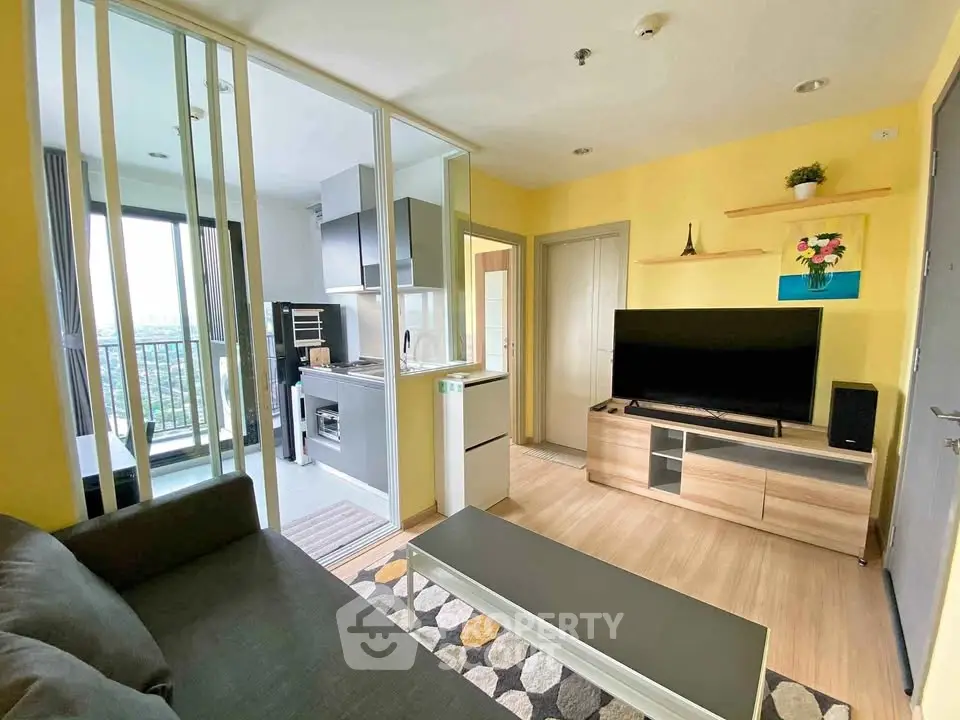 Modern living room with open kitchen and balcony view in vibrant apartment
