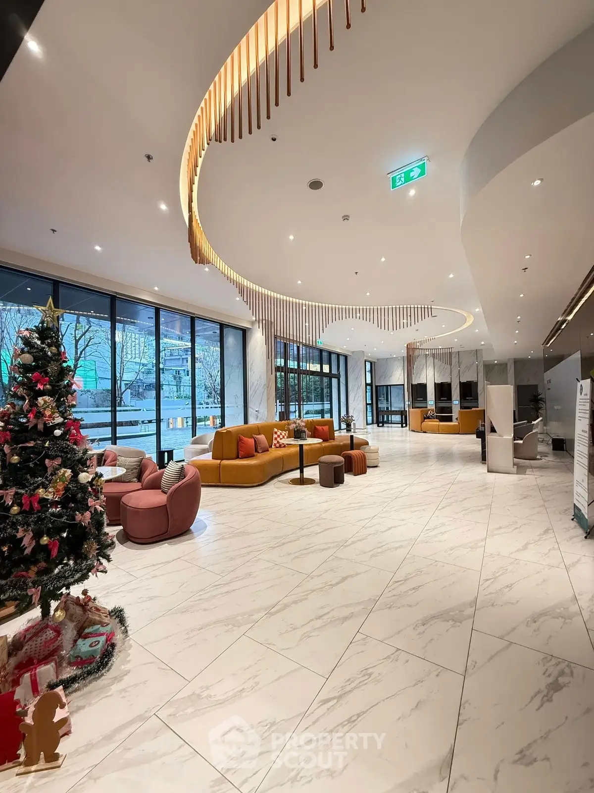 Luxurious hotel lobby with modern decor and festive Christmas tree