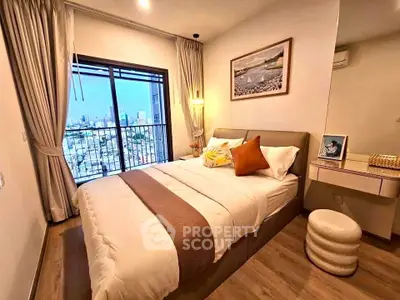 Cozy bedroom with city view, elegant decor, and natural light in modern apartment.