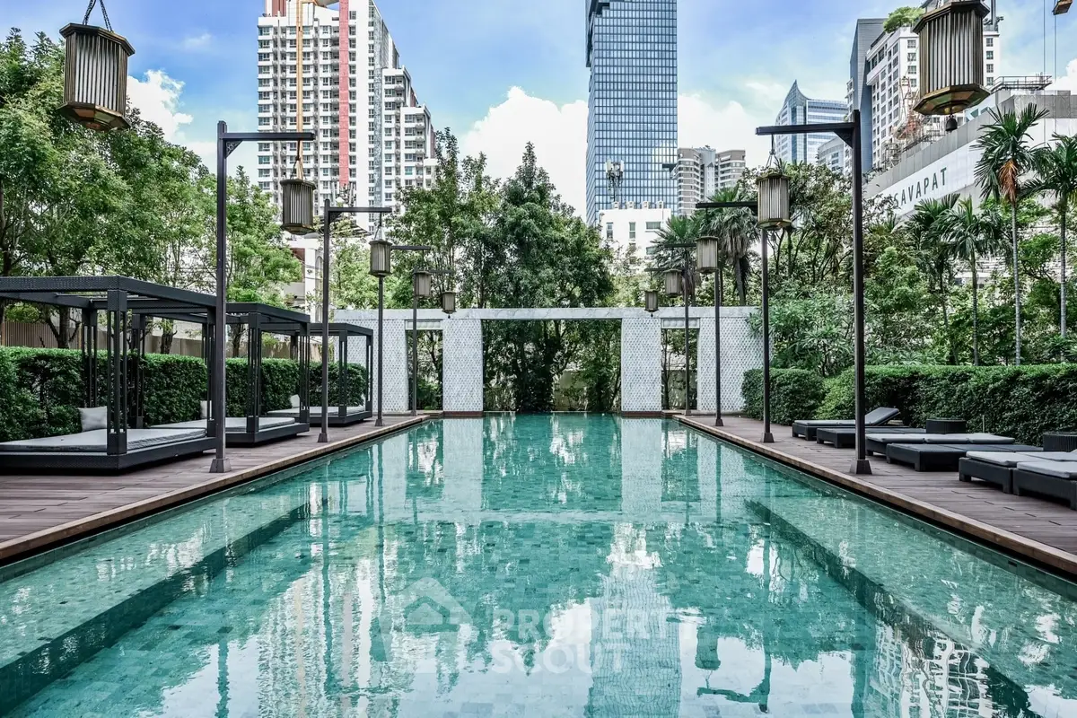 Luxurious urban pool with city skyline view, surrounded by lush greenery and modern architecture.
