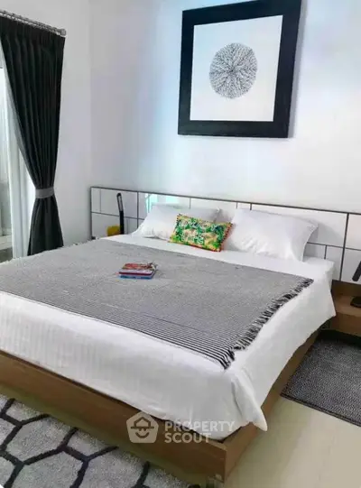 Modern bedroom with stylish decor and cozy bedding in a contemporary home.