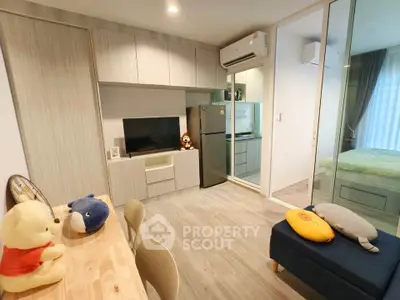 Modern apartment interior with open living area and cozy bedroom