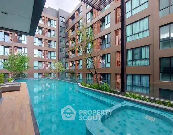 Modern apartment complex with luxurious swimming pool and jacuzzi