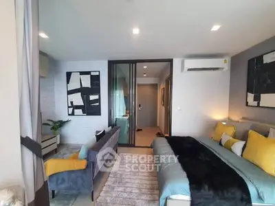 Modern bedroom with stylish decor and cozy seating area