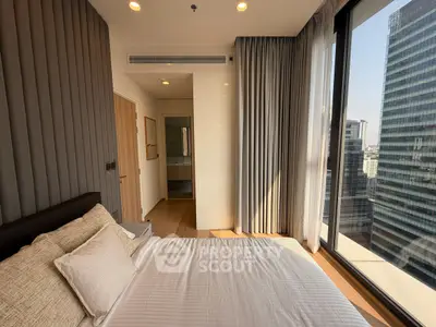 Luxurious bedroom with floor-to-ceiling windows offering stunning city views in a modern high-rise apartment.