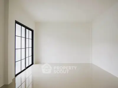 Spacious empty room with large windows and glossy tiled floor, perfect for customization.