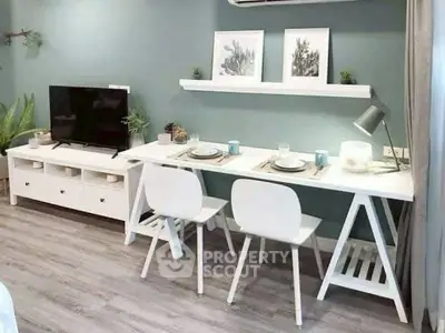 Modern living room with sleek white furniture and stylish decor, perfect for contemporary urban living.