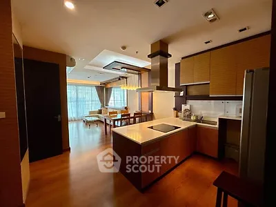 Spacious open-layout kitchen and living area with modern design and natural light.