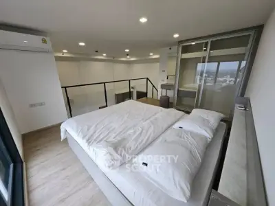 Modern loft bedroom with city view and sleek design