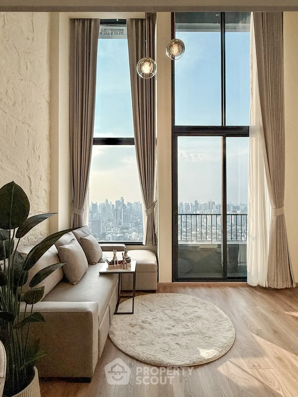 Luxurious living room with floor-to-ceiling windows and stunning city view