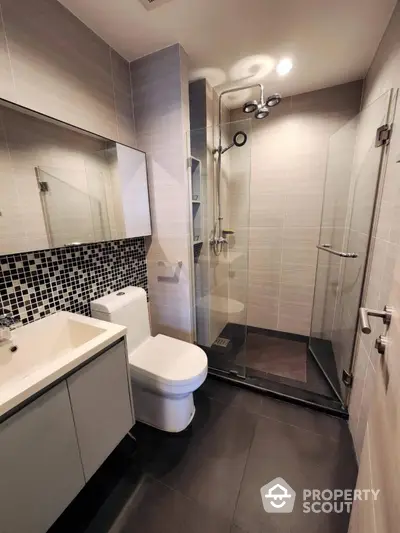 Modern bathroom with sleek shower and stylish tiles