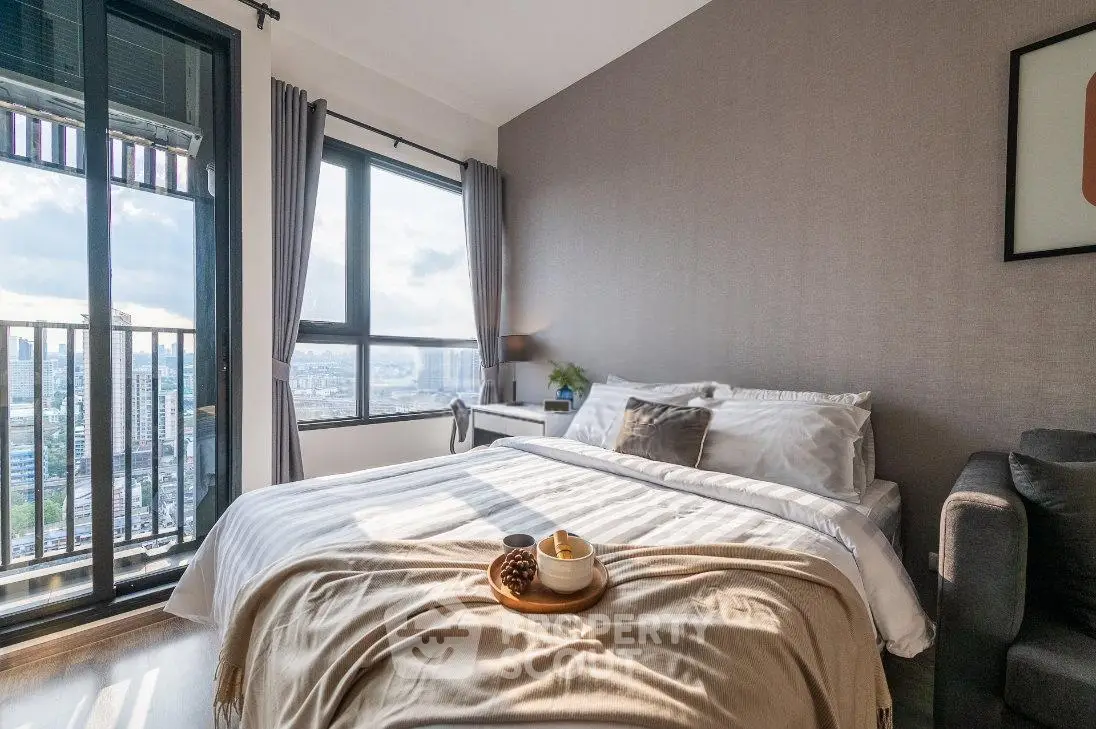 Bright and cozy bedroom with city view and stylish decor