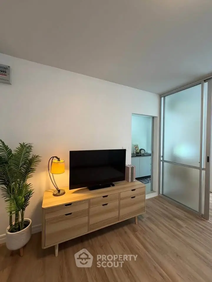 Modern living room with wooden flooring and stylish TV stand
