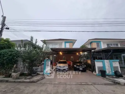 Charming suburban house with carport and lush greenery in a peaceful neighborhood.