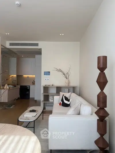 Modern living room with stylish decor and open kitchen layout