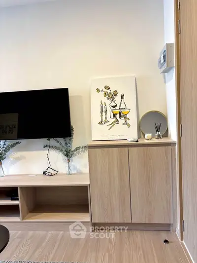 Modern living room with stylish decor and wall-mounted TV