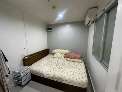 Cozy bedroom with modern air conditioning and ample natural light