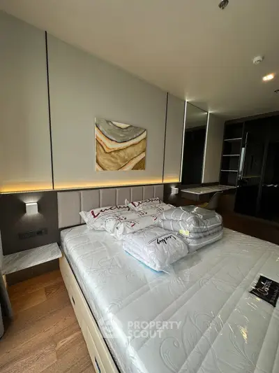 Luxurious bedroom with modern decor and ample storage space