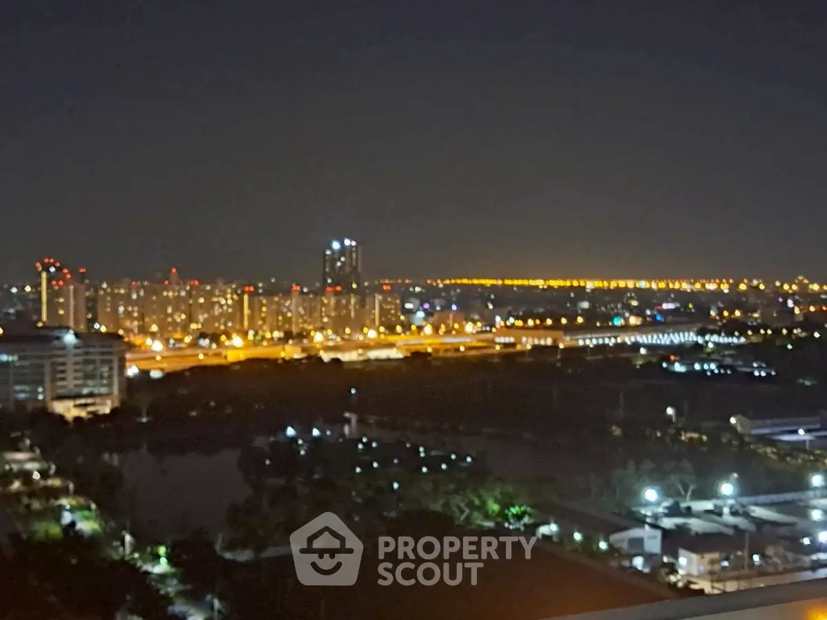 Stunning cityscape night view from high-rise apartment balcony
