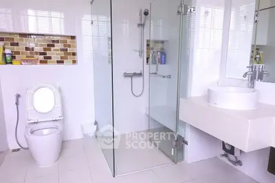 Modern bathroom with glass shower and stylish tile accents